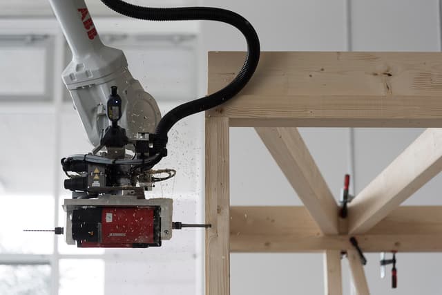 Robotic Fabrication of Bespoke Timber Frame Modules